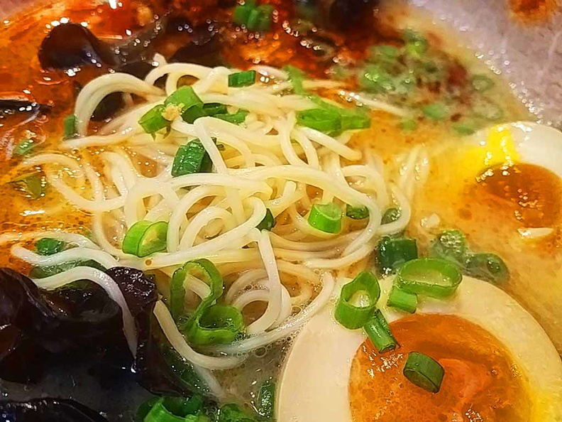 Thin ramen noodles in spicy broth