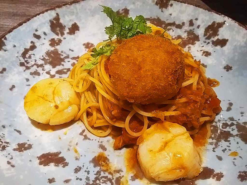 Scallop and crab croquettes with tossed spaghetti with chili crab sauce 