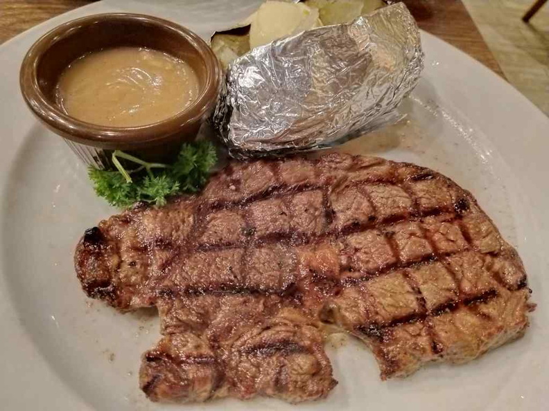 Steaks served medium done, with meat spotting meshed flame-grill marks