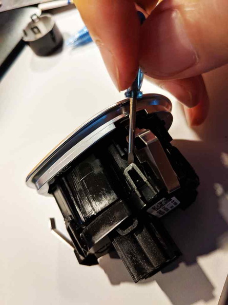 Take caution when removing the clips on the assembly as the plastic is really thin and can snap off easily with excessive force. Start by unlocking the clips on one side and working around in a circle
