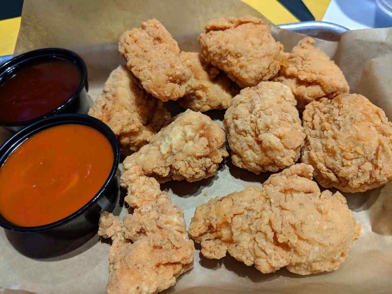 Boneless chicken tenders are crispy and chewy. They are tad easier to eat with the sauces