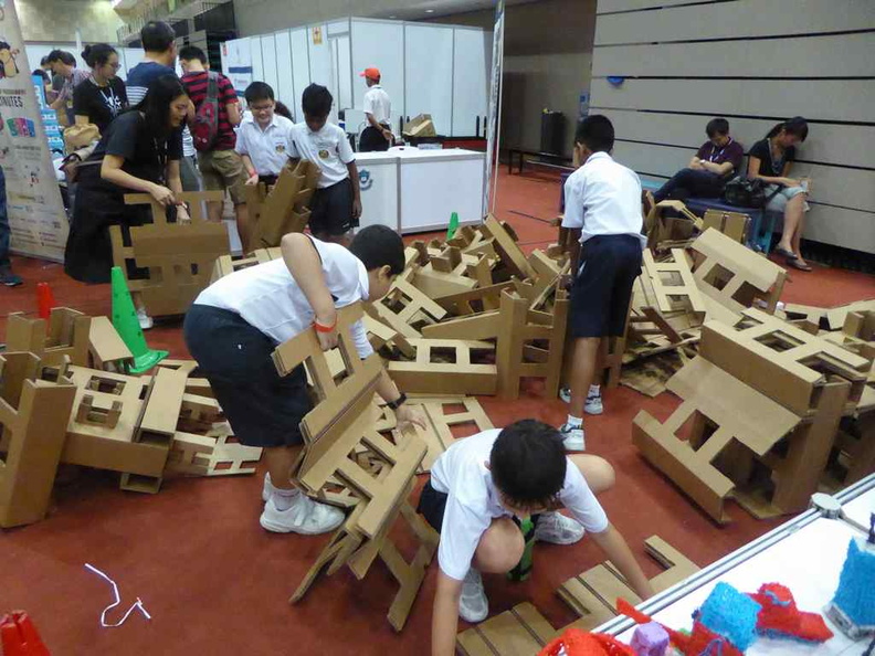 Students constructing structures at the Cardboard Octomaker
