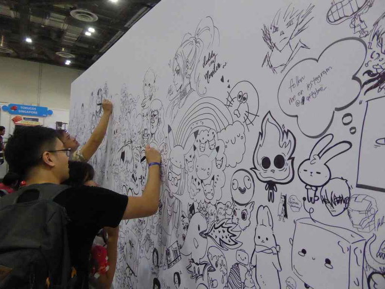 The STGCC Doodle art wall is brimming with artwork contributed by anyone with a pen wiling to doodle onto it