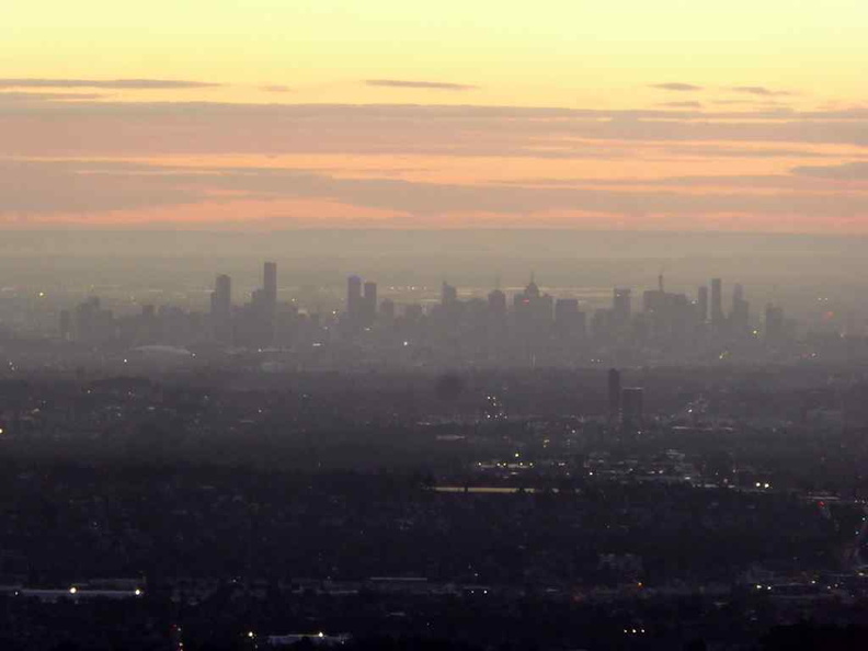 A distant Melbourne city seen from afar on the mountain
