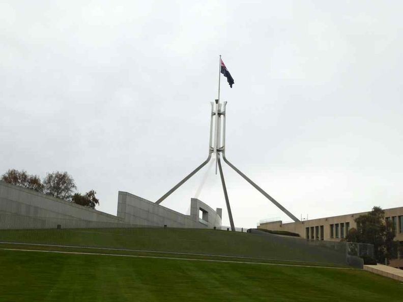 The highly distinguishable giant four legged flagpole sitting above the new Parliament House