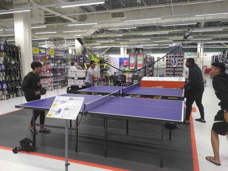 Patrons using the open Table Tennis tables. It is quite a popular station in the store