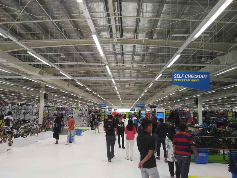A vast central open hallway greets you as you enter the store. Sports equipment are tucked on the sides with each aisle dedicated to a sport each.