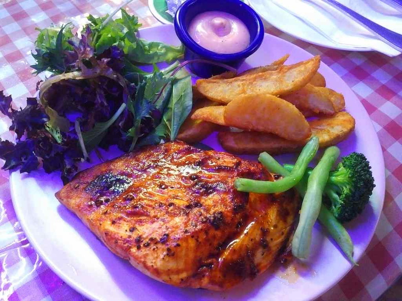 Their Grilled Salmon, the fish is juicy and soft. It is cooked lightly seared on the exterior but retains an otherwise soft juicy inner core