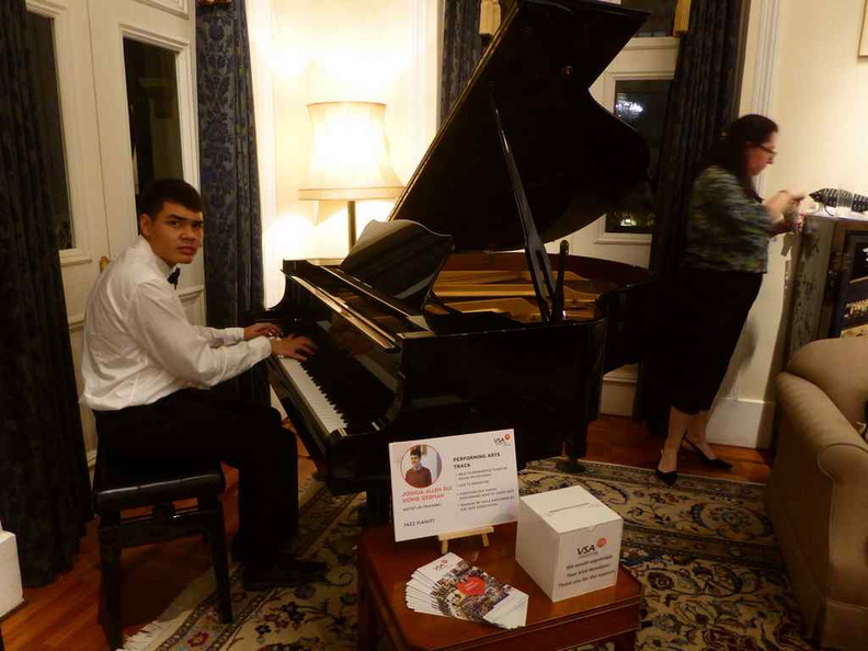 Joshua German performing on the piano at the event lounge. , filling the halls with his music