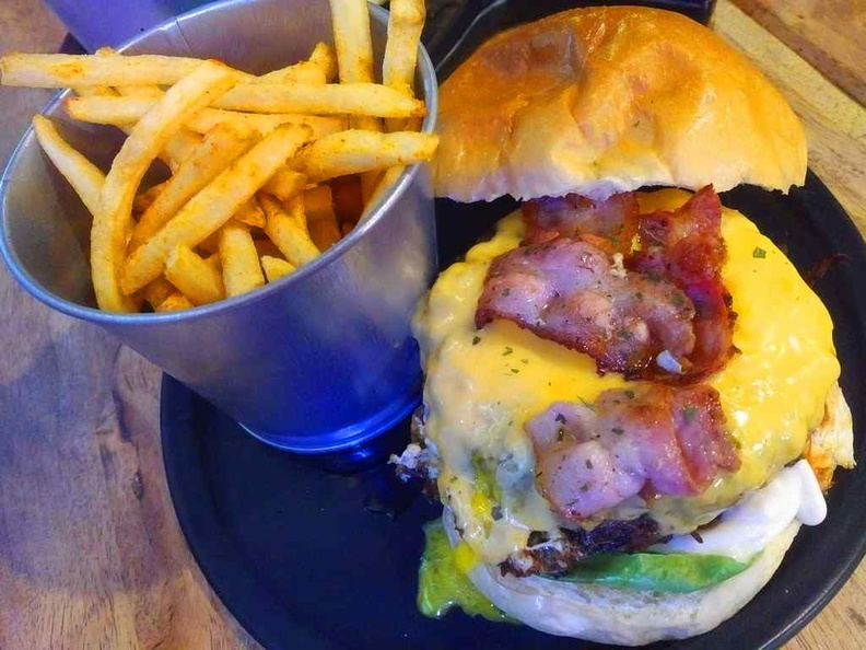 The Truffle Wagyu burger, it comes served with a small bucket of fries with a beer at a value $18.90