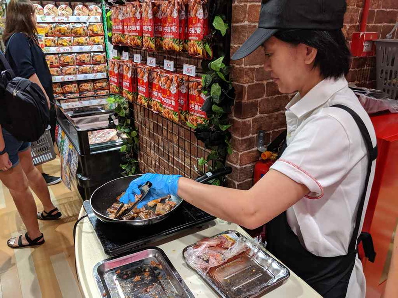On-site promoters cooking and allowing guests to sample the Shabu Shabu meats