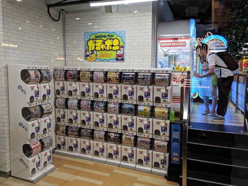 The Gashapon wall at the exit of the outlet. There is also a row of UFO catcher machines alongside it