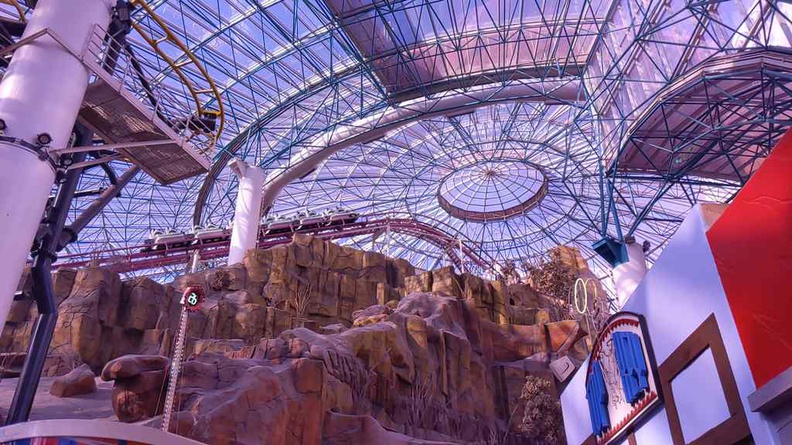 The hill climb of the Canyon Blaster roller coaster, going up to almost the dome ceiling