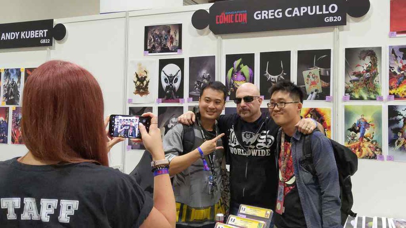 Greg Capullo posing with fans for a photo