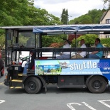 An electric hop-on town shuttle service.