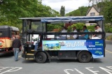 An electric hop-on town shuttle service.