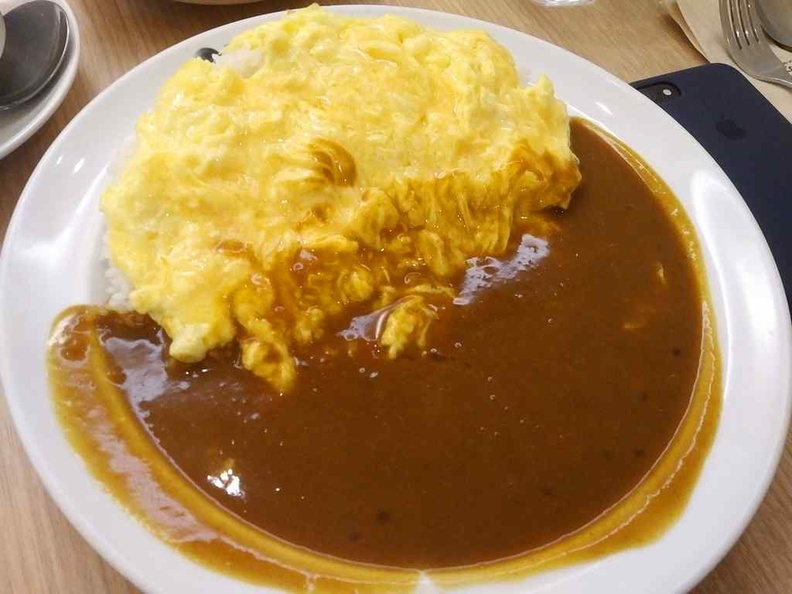 Check out the Omu (omelet rice) it is as basic a meal can get here besides their sausage curry rice