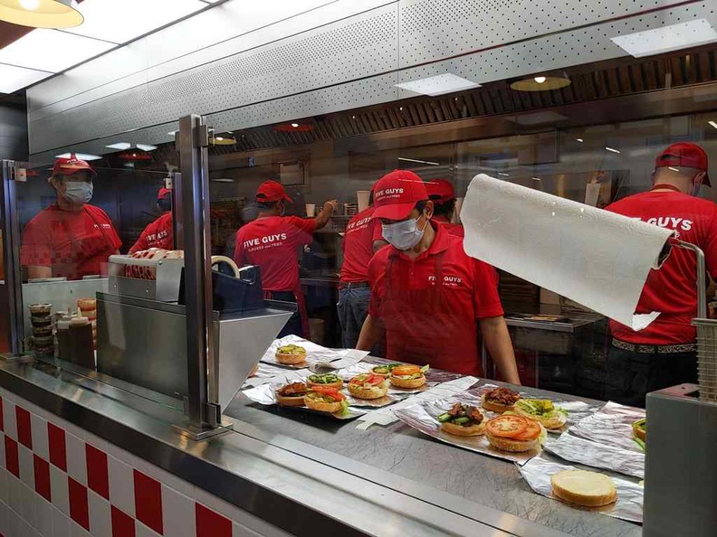 Five guys burgers kitchen runs like clockwork churning out tons of burgers at a go, especially on peak mealtimes.