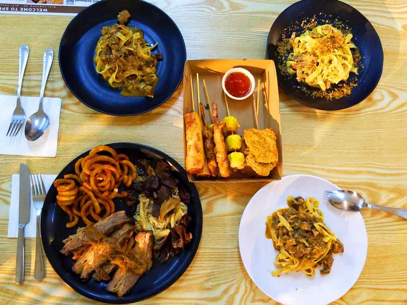 Meat and Greet beef brisket, pictured with pasta offerings and Asian skewers from Lok-kol