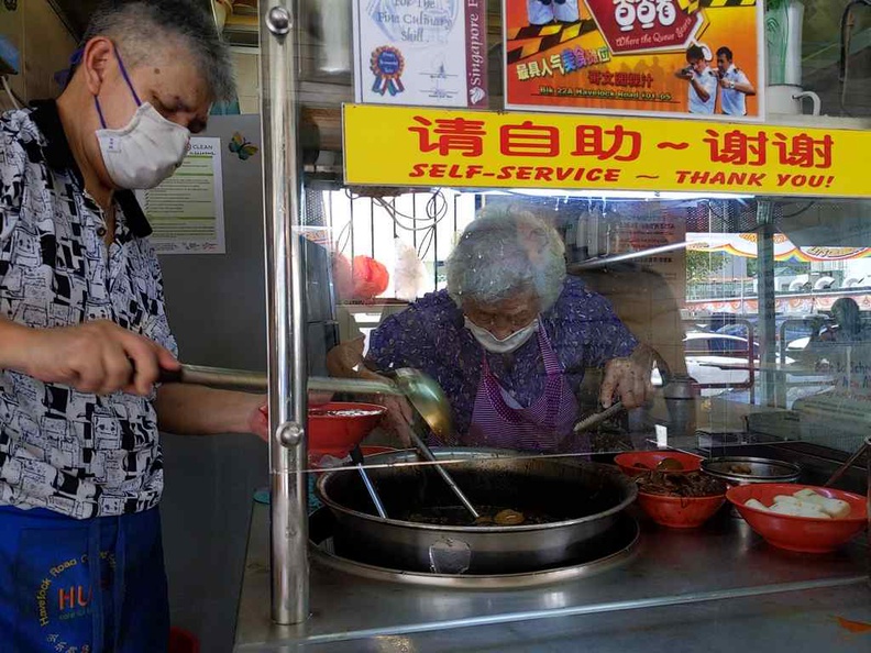 Mdm Chua at work, even after over 50 years behind the wok