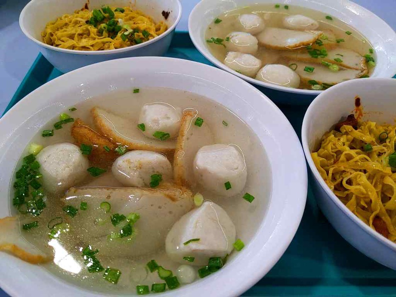 Ru Ji fishball noodles platter with servings of noodles dry and soup bowls