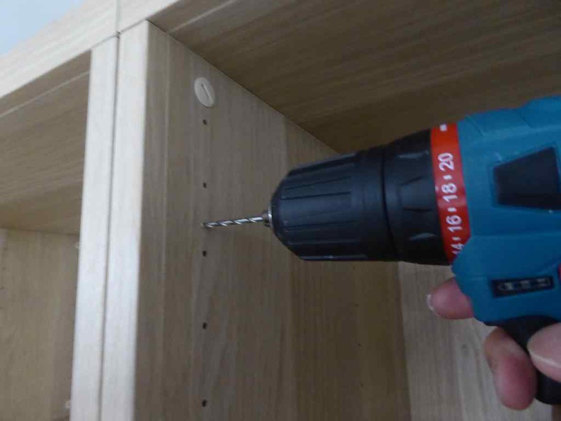 Drilling in the secondary mounting hole points for your UTRUSTA hinges. in the BESTA cabinet