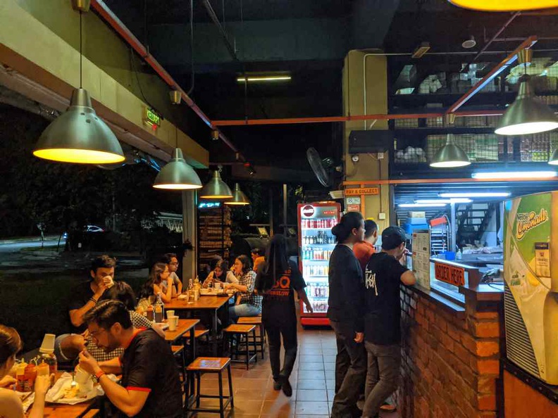 The interior of Beard brothers BBQ restaurant, with a mix of indoor and outdoor non-air conditioned seating