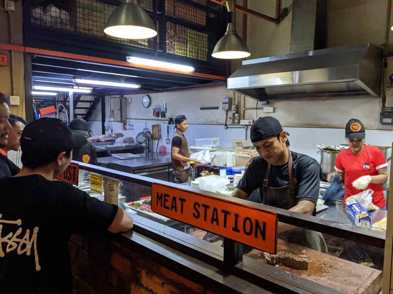 The open concept meat station where you can see staff working to prepare your BBQ