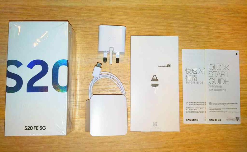 Basic box contents with included USB charger, cable and SIM tray pin