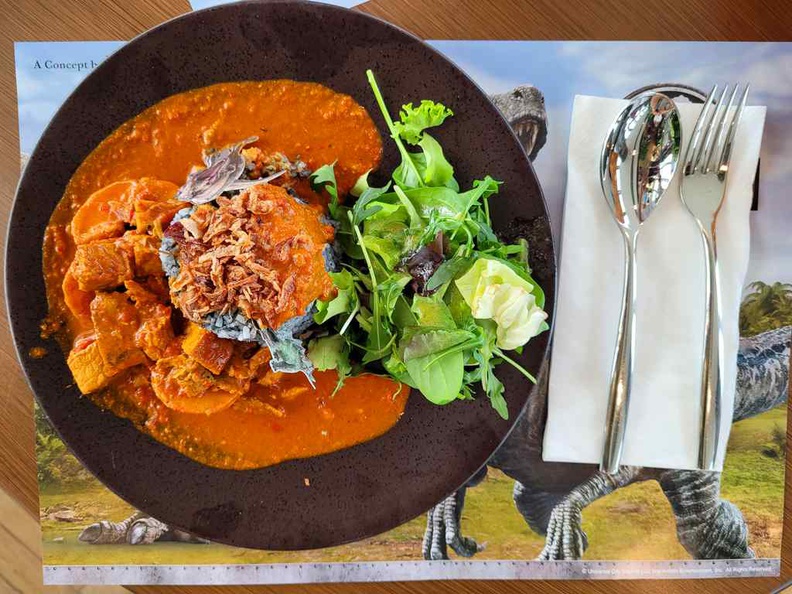 Volcano Curry ($23) comprises of olive rice with mild curry chicken and a salad side