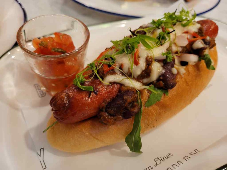 Chilli Beef Hot Dog ($10) with smoked taste and topped Chilli Con Carne, Pico De Gallo and Mozzarella Cheese