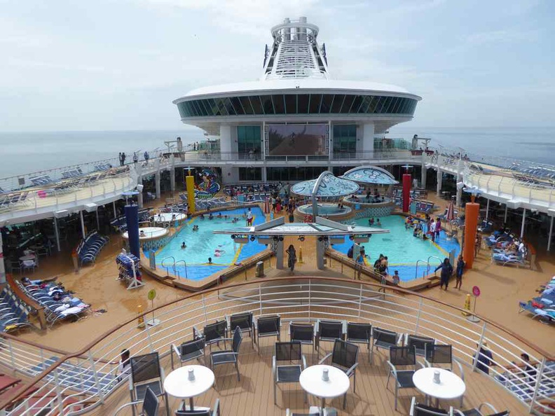 The top floor pool area of the Royal Caribbean Mariner of the Seas, with the Singapore skyline in the distance