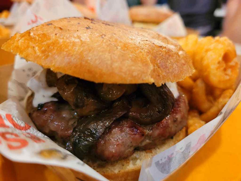 Royal Mushroom beef ($15), Charcoal grilled beef with charcoal grilled onion, wood fire smoked mushroom, blue cheese sauce and brioche buns