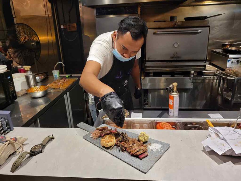 Social Outcast Bedok Steak works in the kitchen