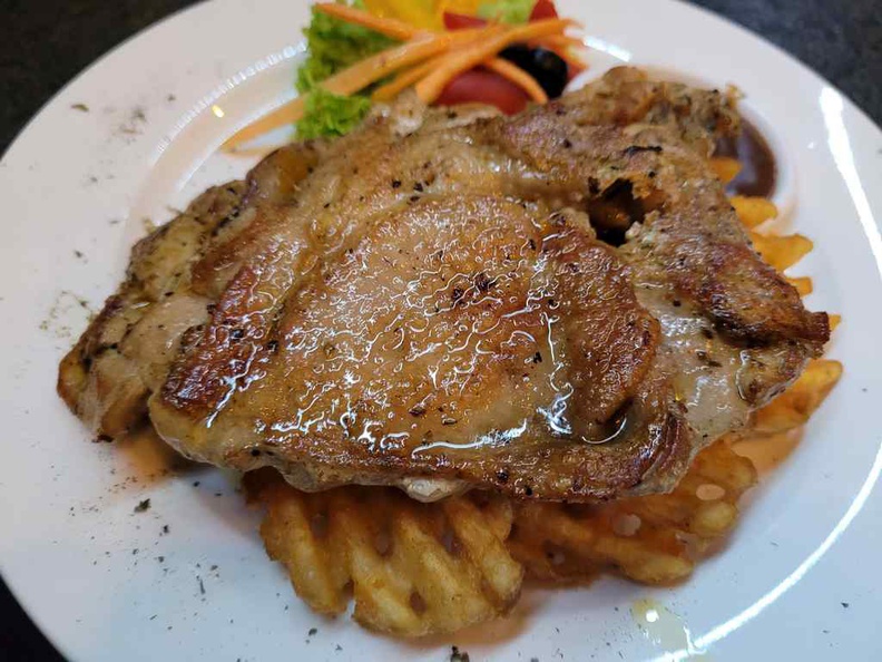 TG Bistro Chicken chop served with waffle fries and salad