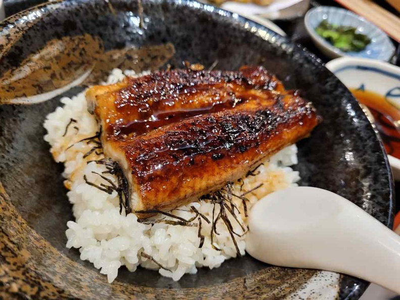 Unadon Tempura ($30), topped with fillets of eel grilled in a style known as kabayaki.