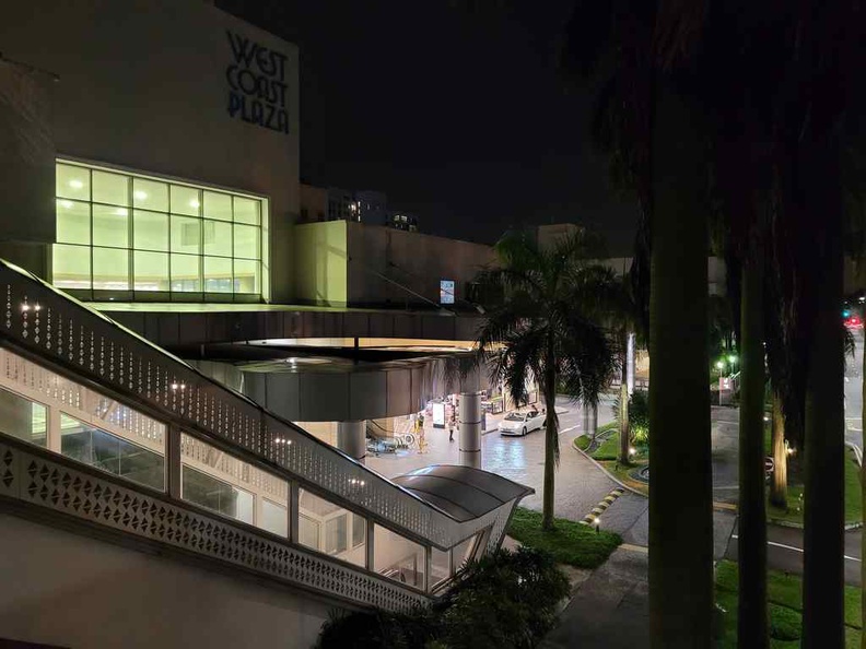 West Coast plaza exterior at night.