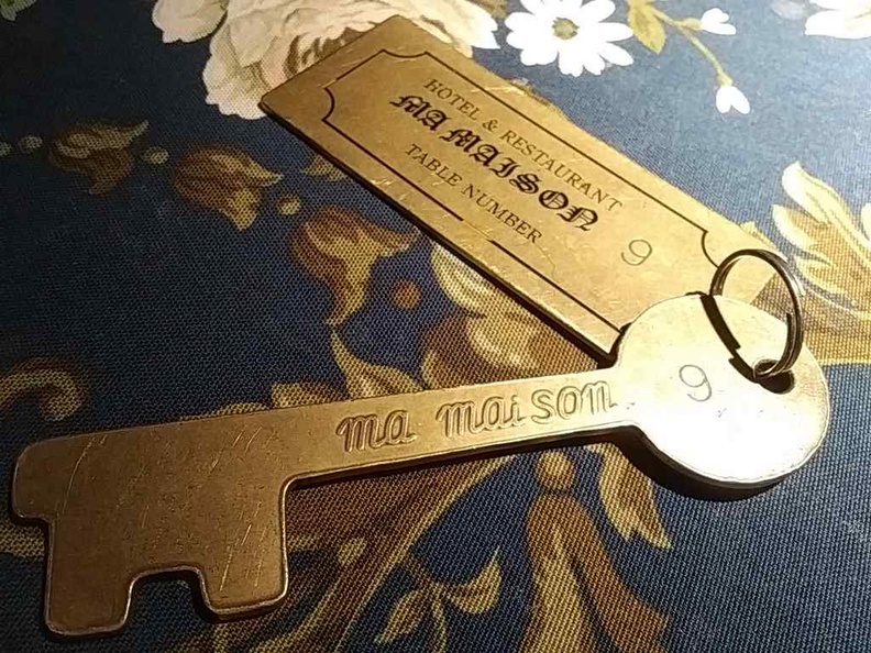 You present these hotel "room keys" to check-out of the Mai Maison establishment when you are done dining