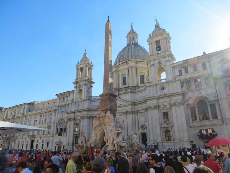 A buzzing Piazza Navona with a full market place.  Rome Italy