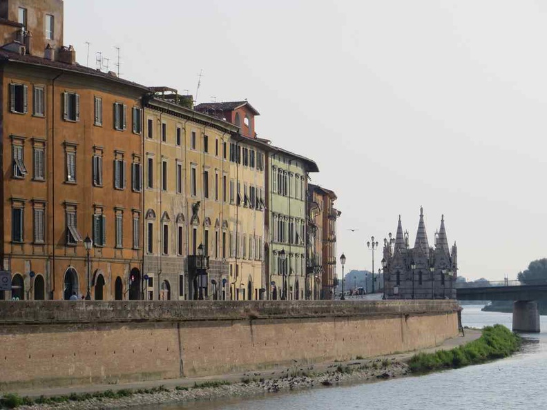 View along the Pisa river Arno with Pisa Italy gothic cathedral Santa Maria della Spina in view 