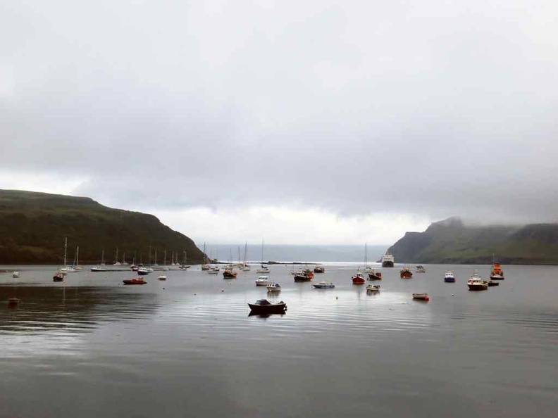 Tranquil fishing villages with boats out by the bay scotland