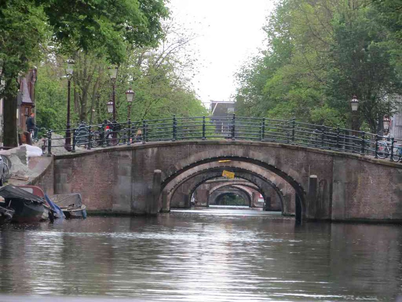 Looking through the vast network of canal and bridges in Amsterdam Netherlands