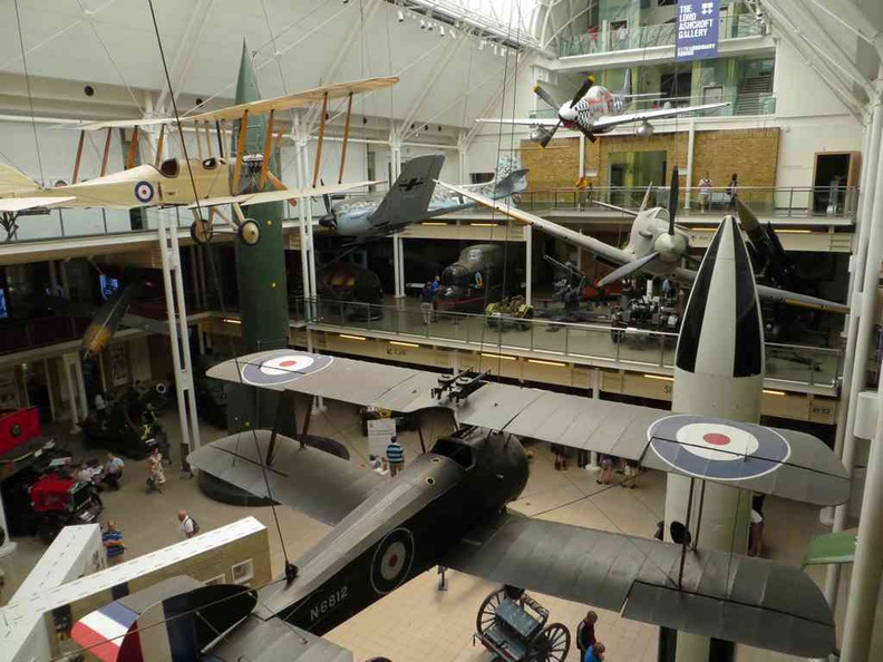 Various classic world war 2 planes hanging from the ceiling