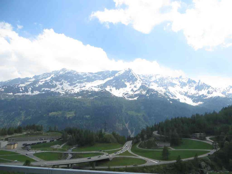 Swiss Mountain roads with snow-capped mountains in the distance