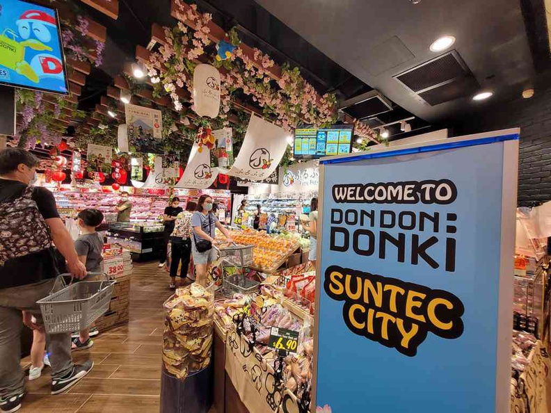 A familiar supermarket entrance greets you at the store front at Don Don Donki Suntec