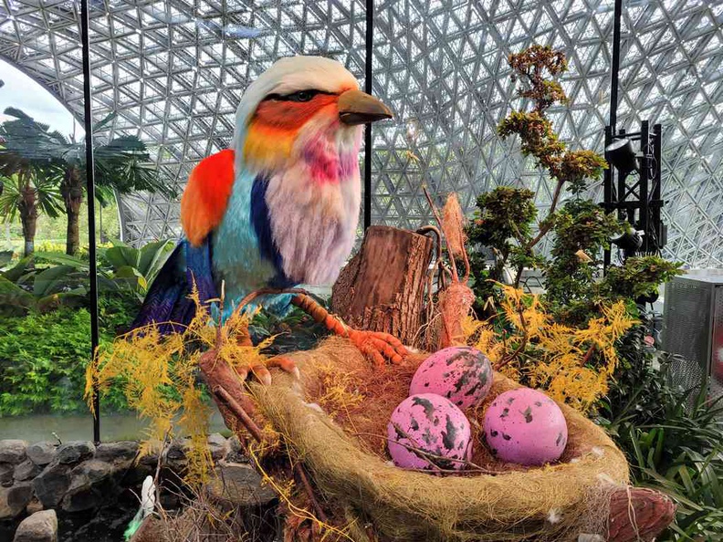 Hand arranged Bird in the pink of health at the Floral Fantasy