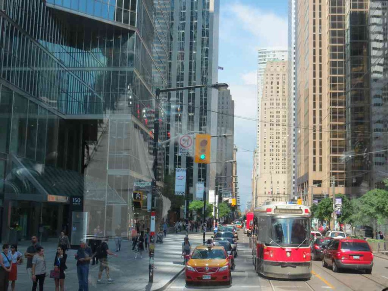 Downtown Toronto canada city with cabs and trams serving the city