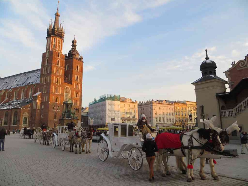 Welcome to Krakow City, Poland. The old town square and St. Mary's Basilica