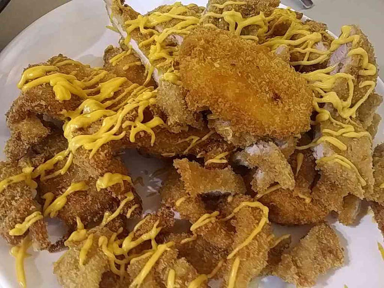 Giant fried platter with mustard toppings