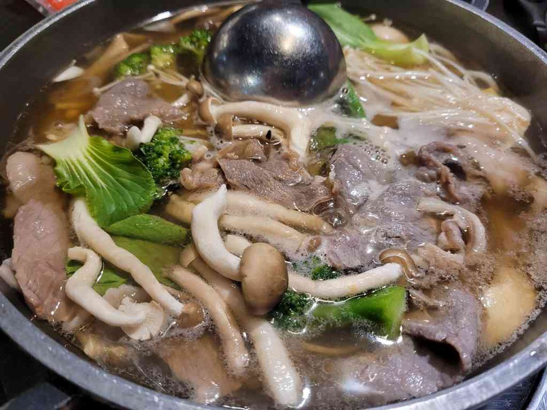A hearty broth of clear soup, a perfect complement to your fried food at Kim Korean BBQ Shabu Shabu
